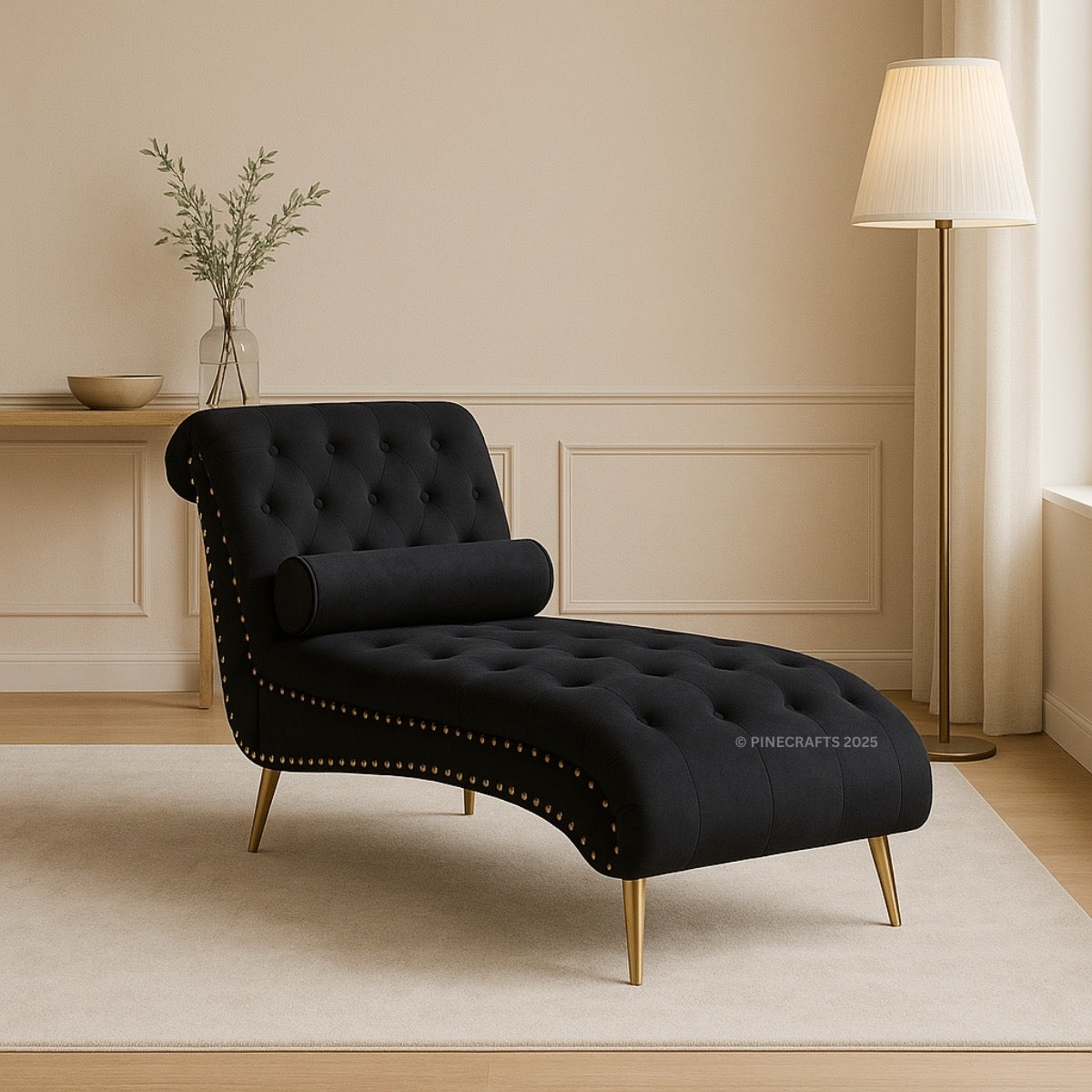 Black tufted chaise lounge in a room with a lamp and decorative items.